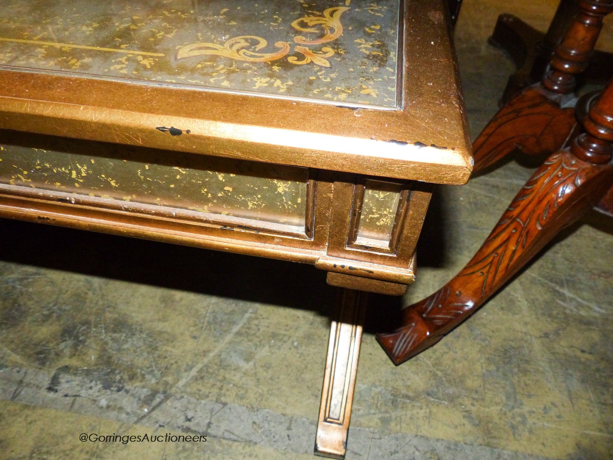 An Italian style gilt and glass 'X' frame coffee table fitted end drawers, length 132cm, depth 80cm, height 51cm